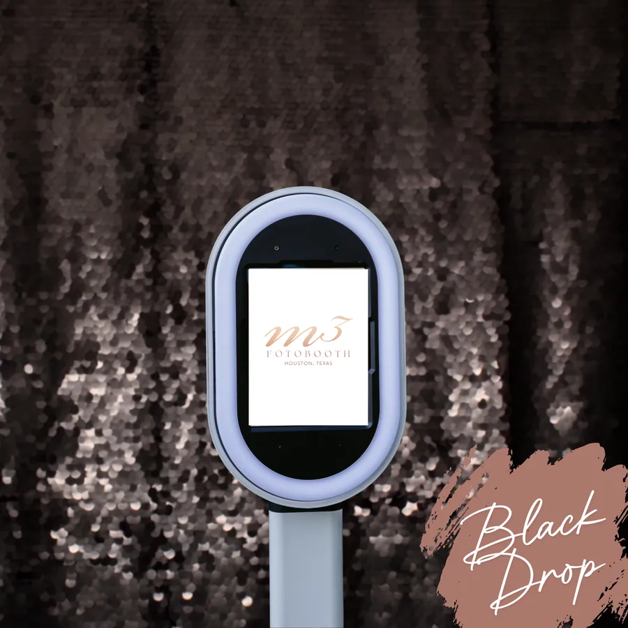 The Black Drop Sequins backdrop behind an M3 Fotobooth booth
